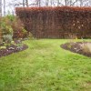 The curved line of the borders now leads your eye around the garden