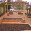 Wooden pergola almost complete, ready for seating