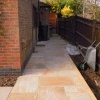 ndian sandstone paving path from back door into garden now looks smart, level and tidy title=